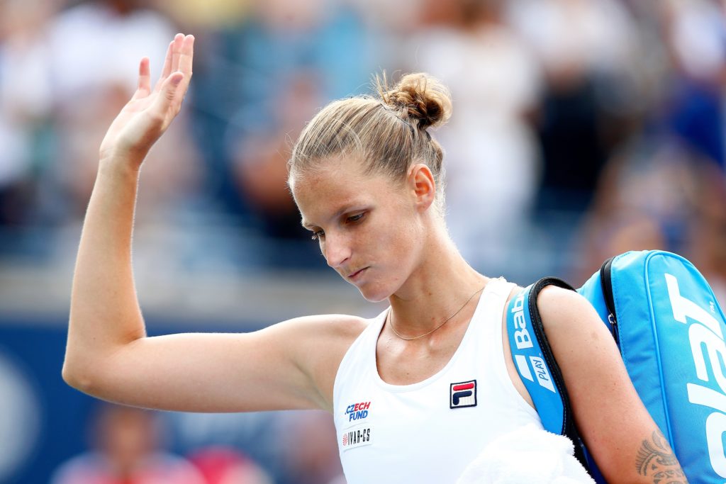 Karolina Pliskova waves goodbye with a sad face