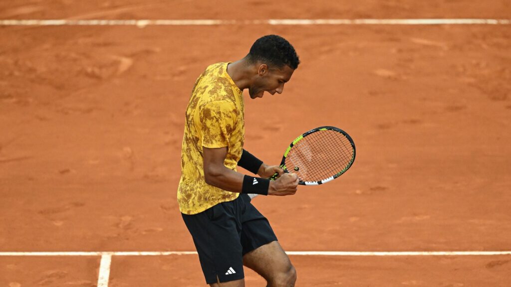 Felix Auger-Aliassime pumps his fist.