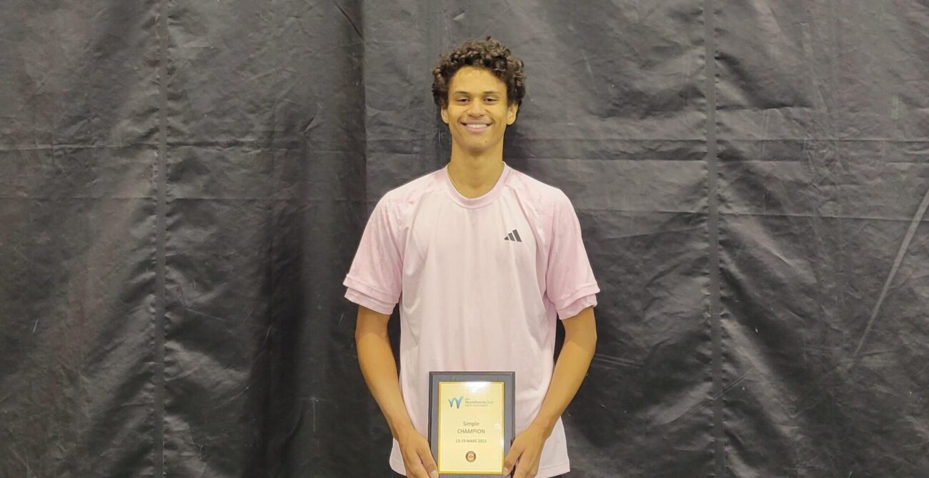 Gabriel Diallo holds his Montreal ITF trophy.