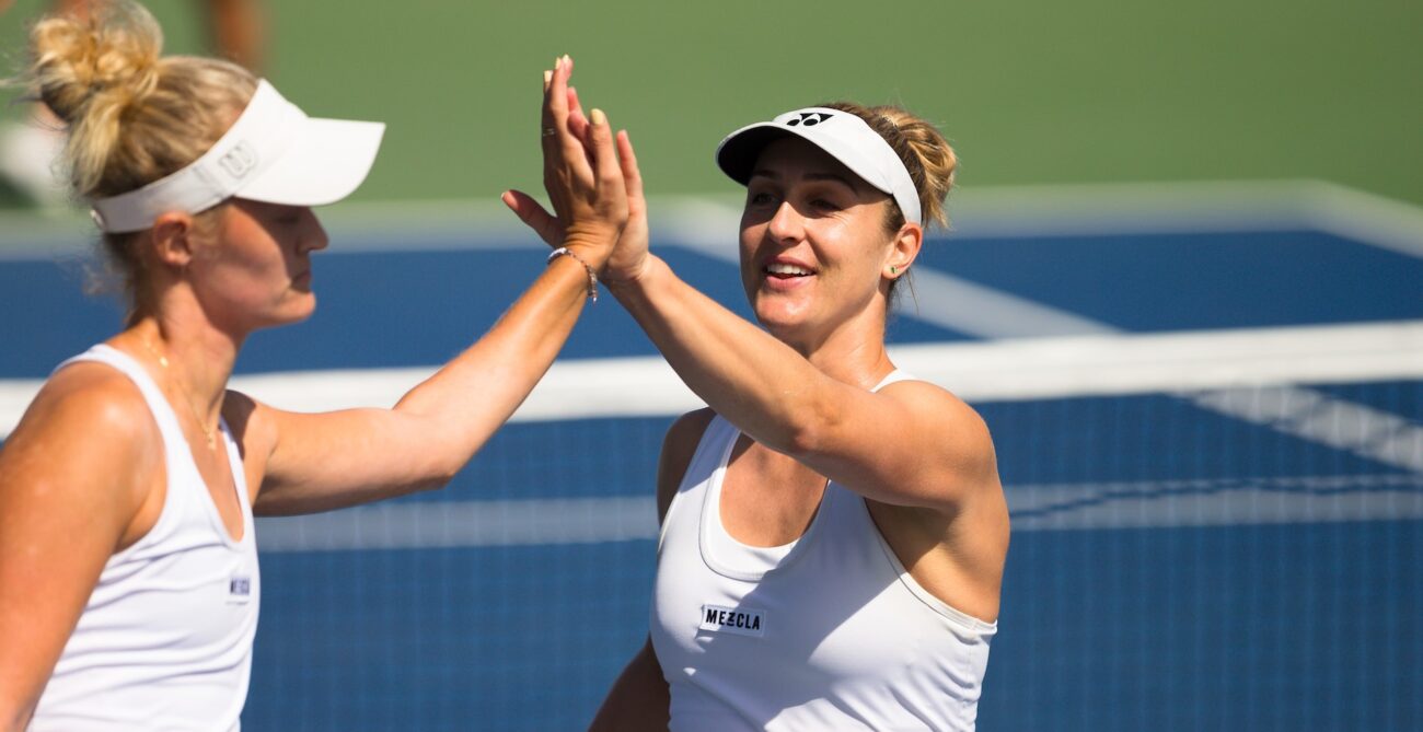 Gabriela Dabrowski high-fives Erin Routliffe.