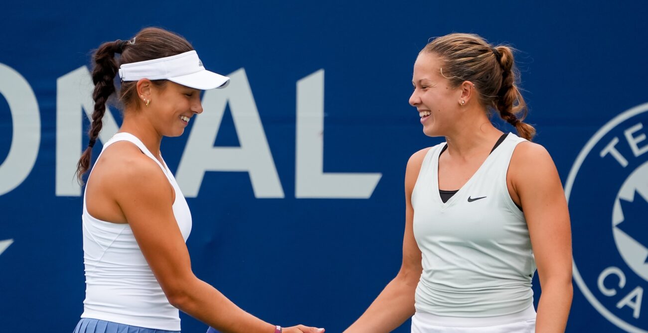 Mia Kupres (left) and Ariana Arseneault high-five. They are competing at a Canadian ITF event this week in Saskatoon.