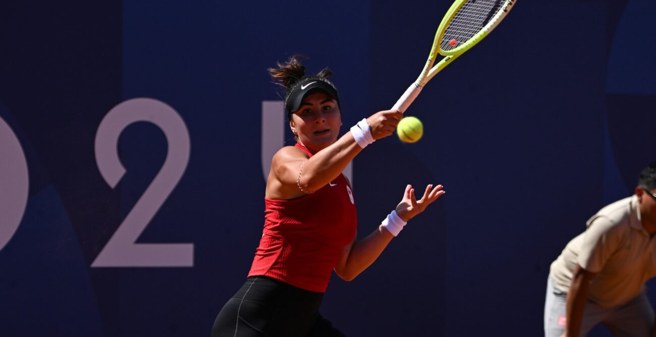 Bianca Andreescu follows through on a forehand during her win over Clara Tauson in her Olympic debut.