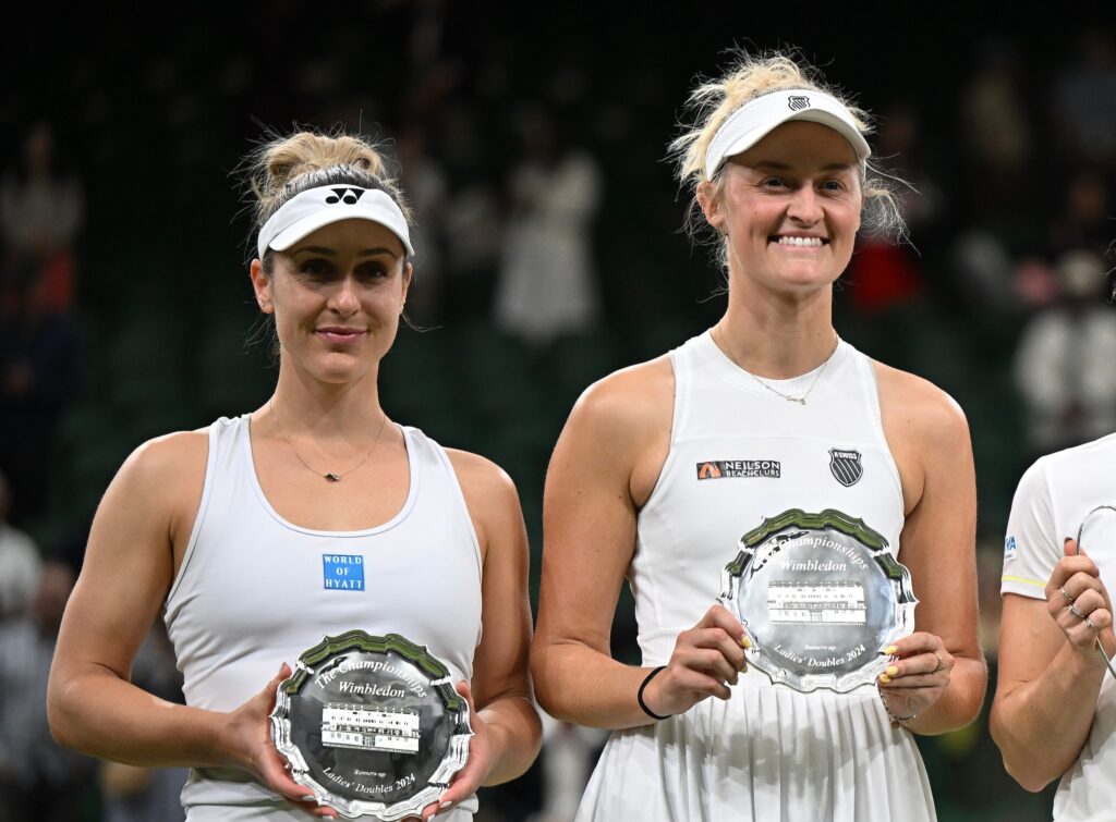 Gabriela Dabrowski (right) and Erin Routliffe hold up their runner-up trophies at Wimbledon. Dabrowski was the only player from Canada left in week two of the Championships.