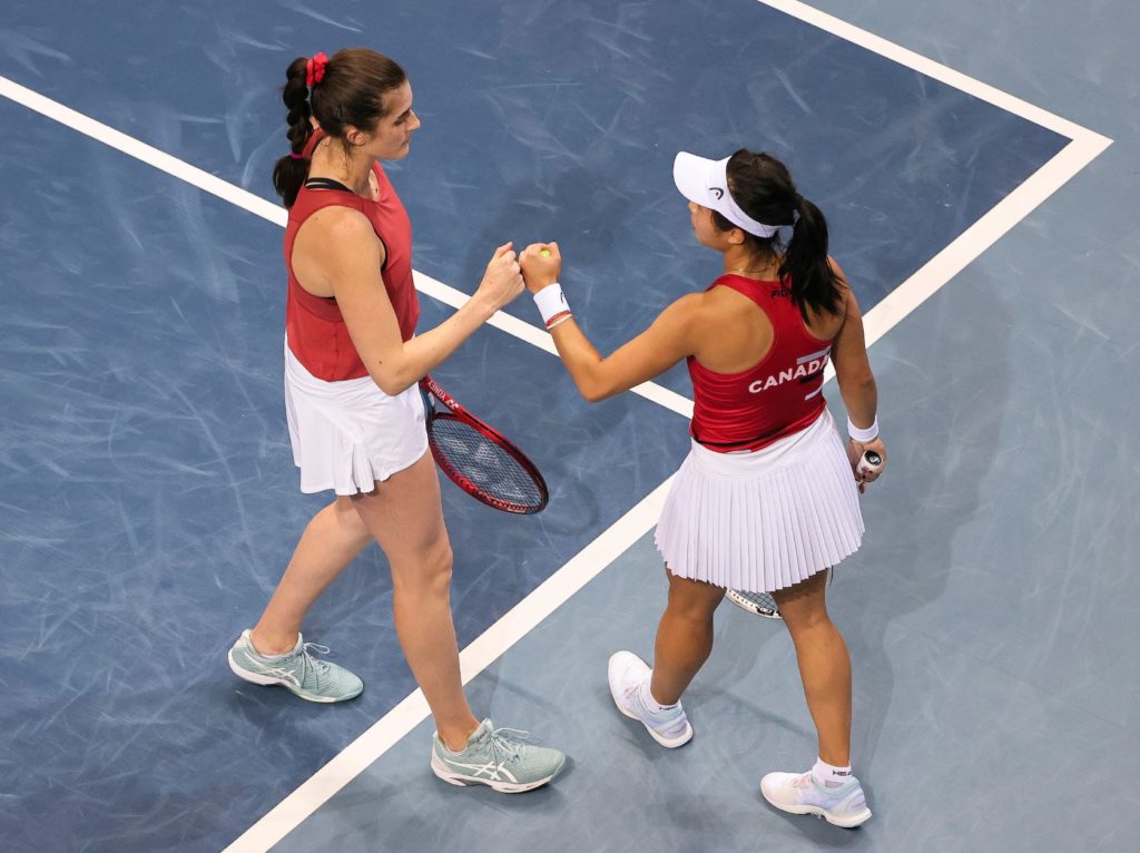 Marino and Zhao fist pump after winning a point in doubles