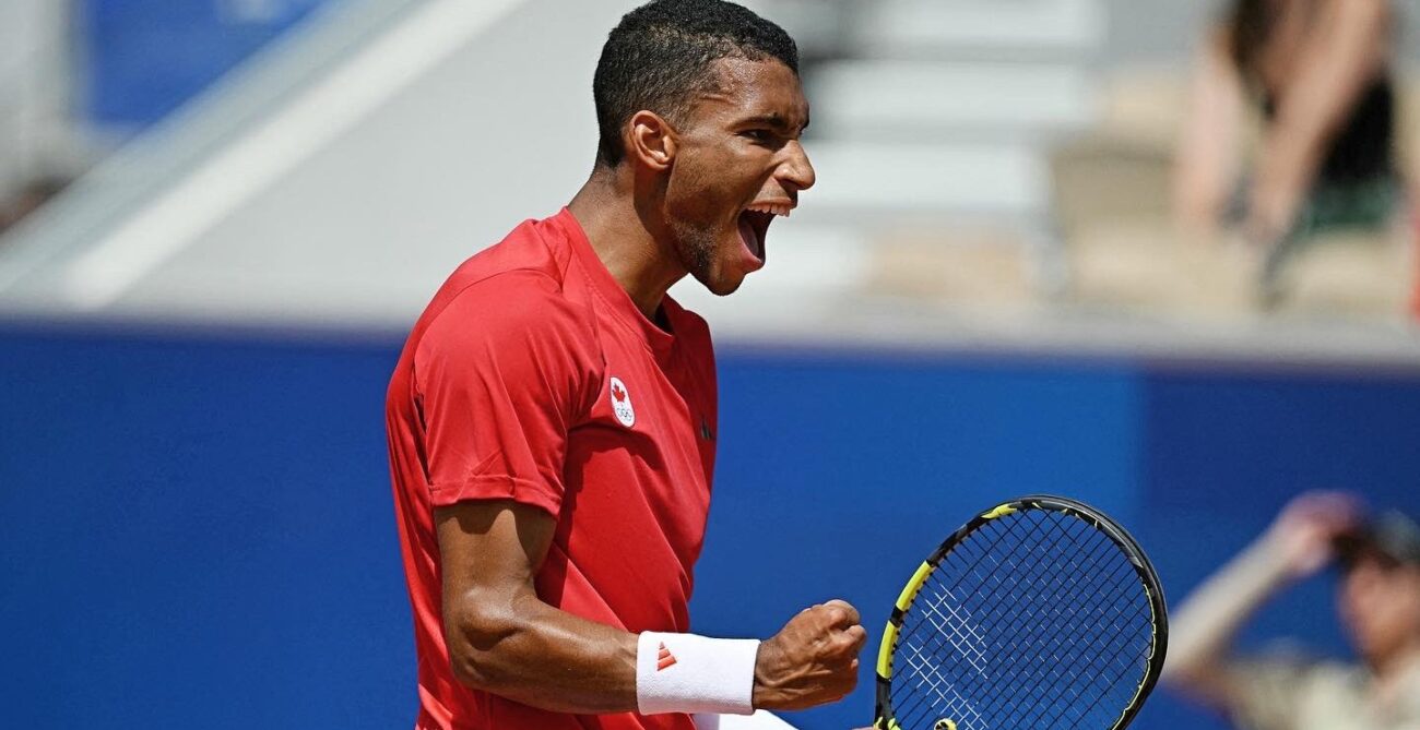 Felix Auger-Aliassime pumps his fist and yells. He is one of fives Canadians who entered the Olympics.