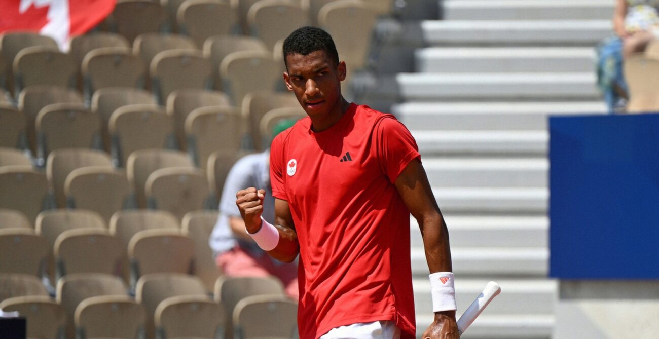 Felix Auger-Aliassime pumps his fist. He defeated Daniil Medvedev to reach the Olympic quarter-finals.