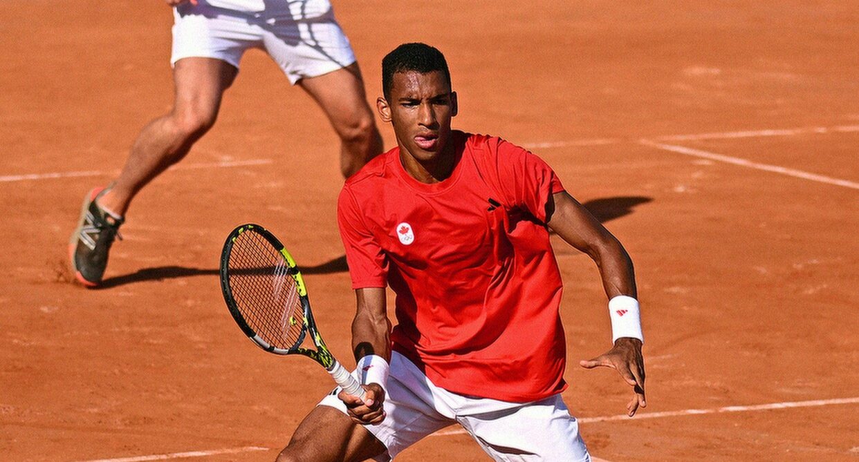 Felix Auger-Aliassime hits a forehand volley. He won on Tuesday, but Leylah Fernandez was eliminated at the Olympics.