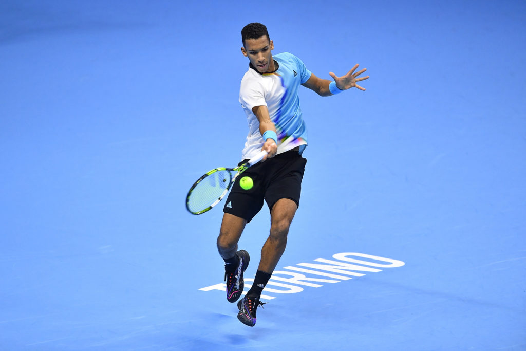 Felix Auger-Aliassime hits a forehand.