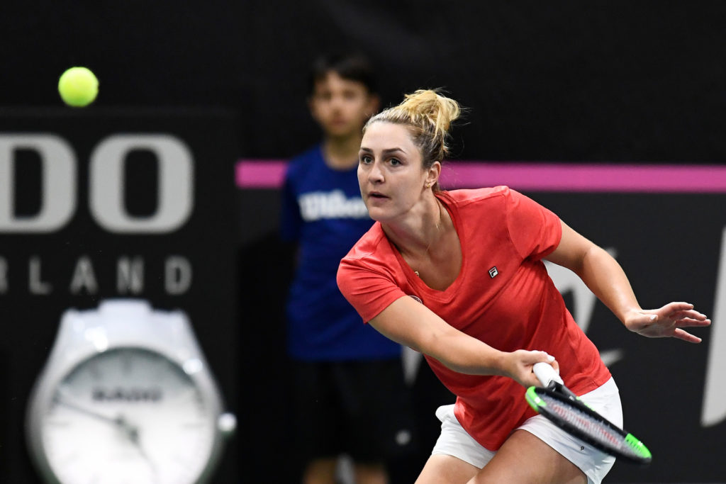 Gabriela Dabrowski hits a forehand volley