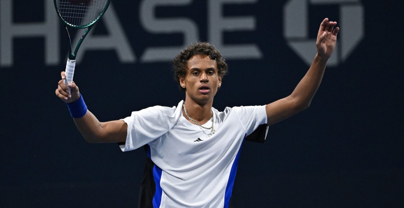 Gabriel Diallo raises his arms in celebration at the US Open. Gabriela Dabrowski also beat Leylah Fernandez in the doubles.