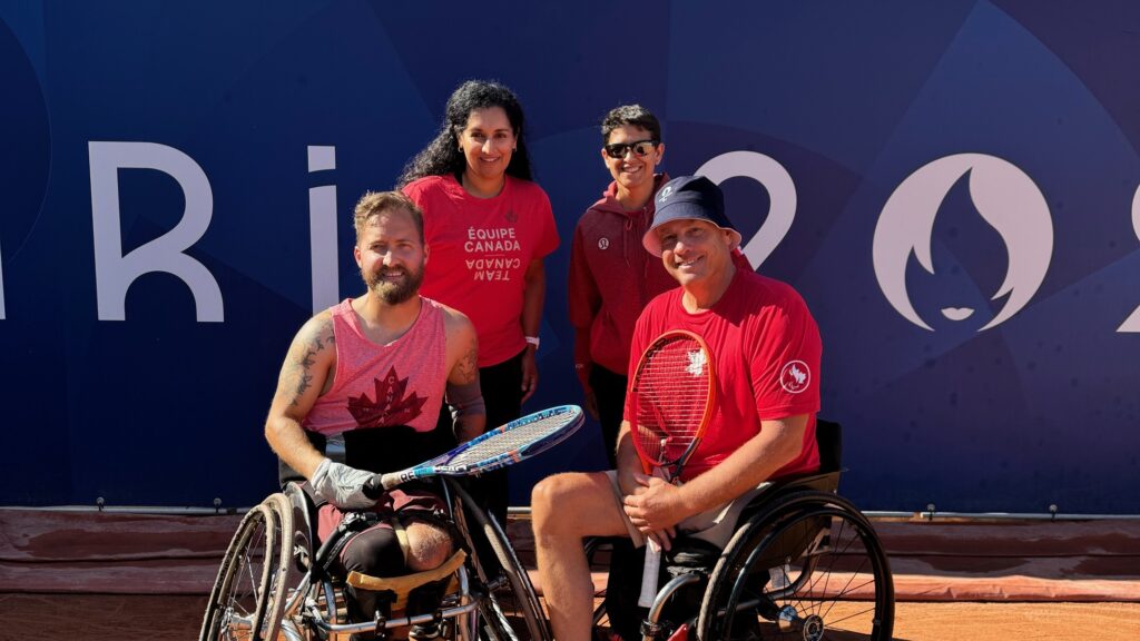 Rob Shaw (bottom left) and his team smile on court. He will play Ymanitu Silva in the first round of the Paralympics.