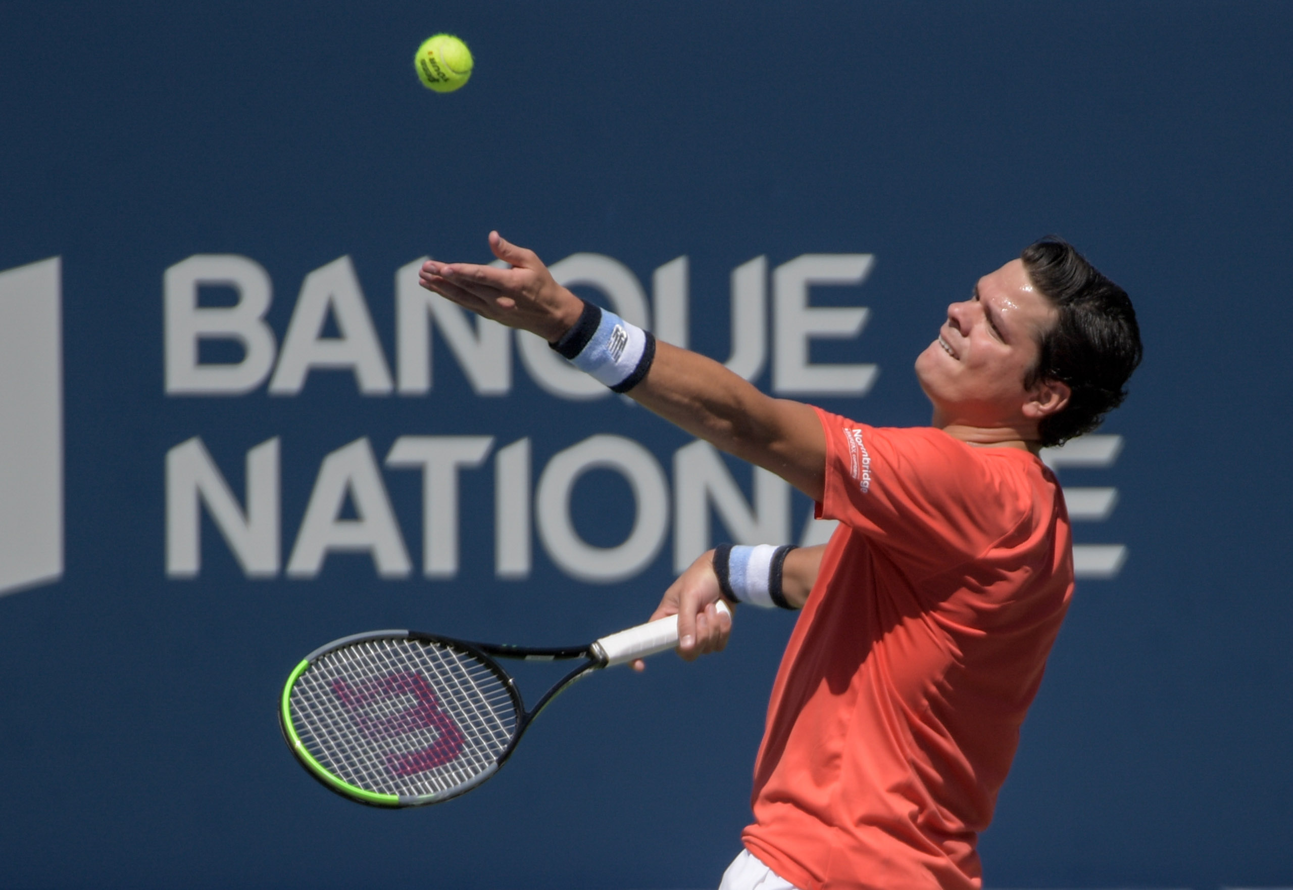 Milos Raonic serving