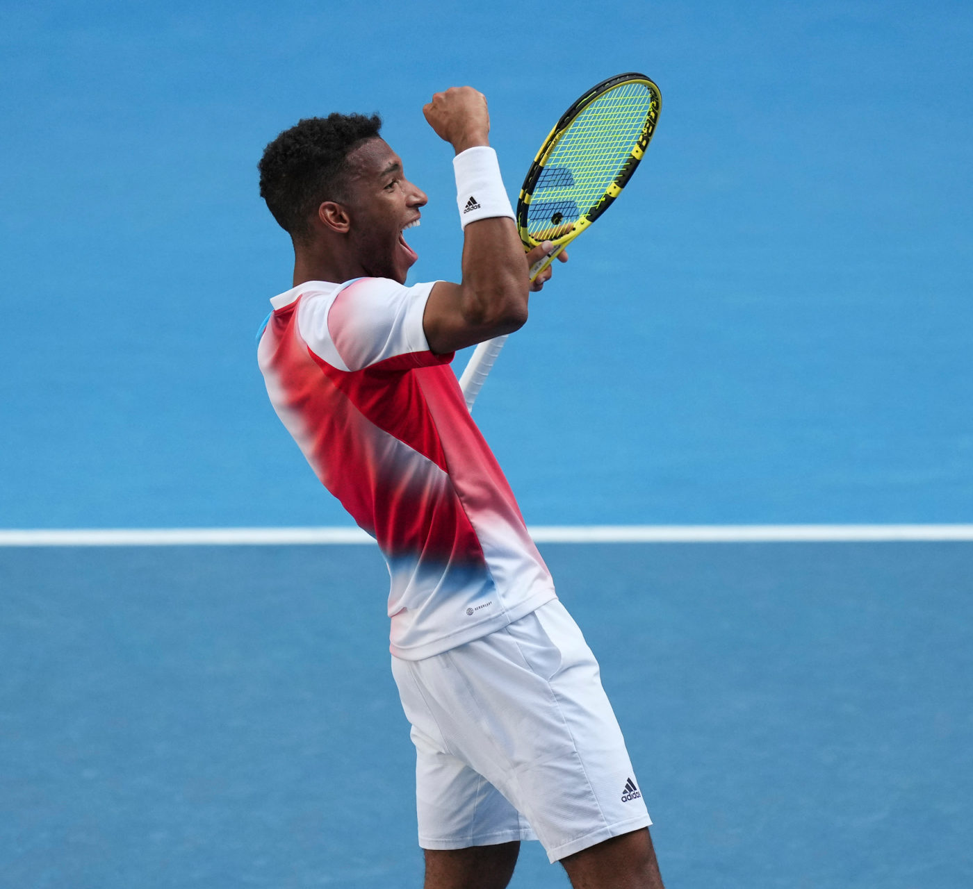 Félix Auger-Aliassime pumps his fist.