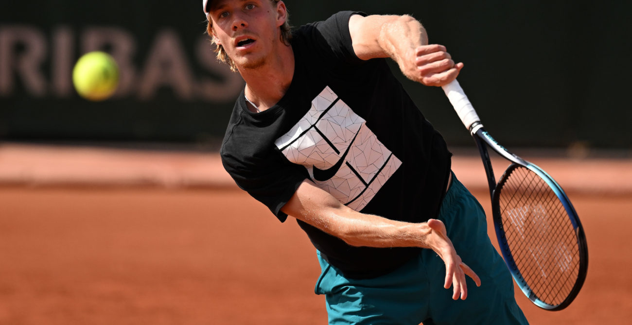 Denis Shapovalov hits a serve.