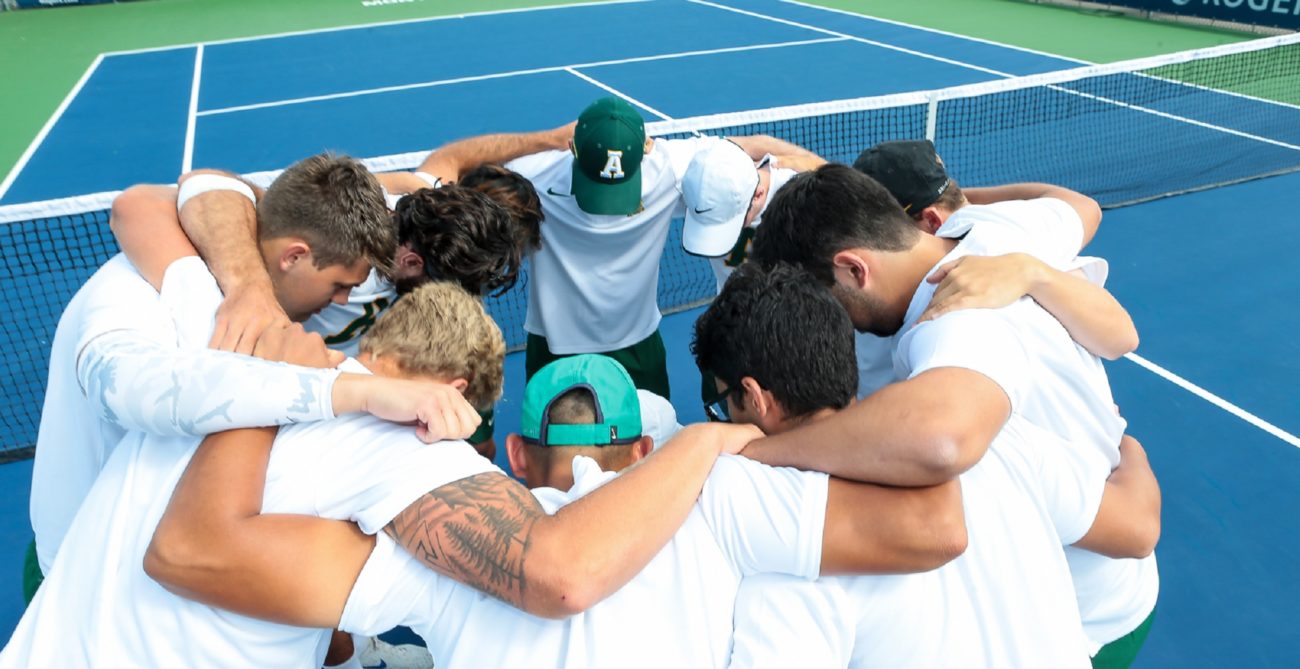 men in huddle