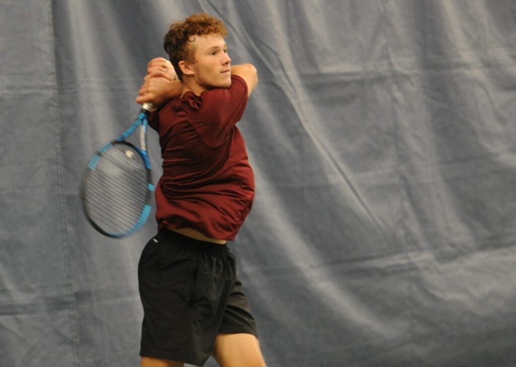 Nicolas Arseneault hits a backhand at the Fischer Junior U18 Nationals