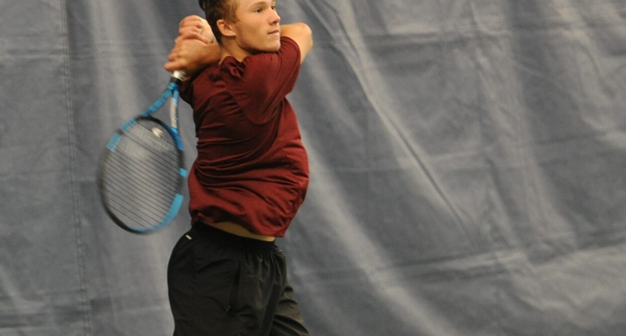 Nicolas Arseneault hits a backhand at the Fischer Junior U18 Nationals