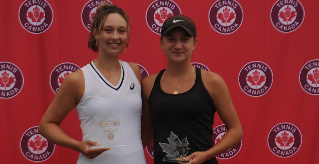 Two Canadian junior players hold their trophies and smile after their final on home soil at the U18s.