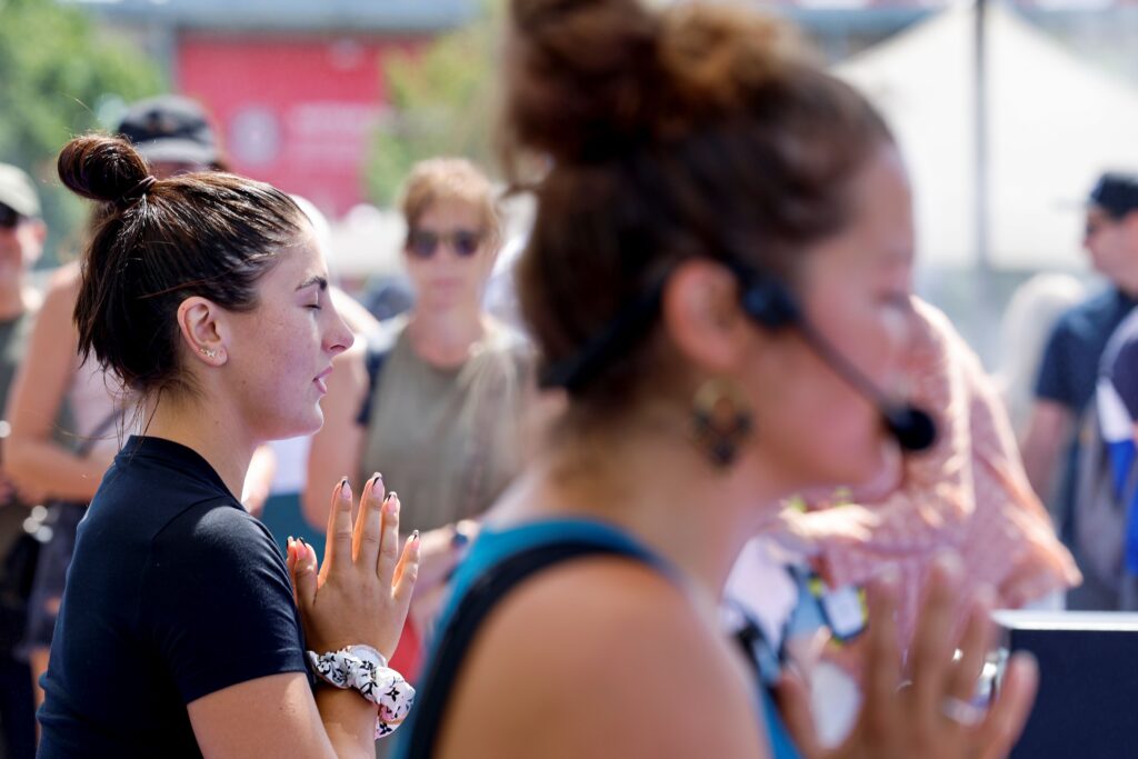 Bianca Andreescu (left) closes her eyes and meditates during a yoga session designed to help with stress and anxiety.