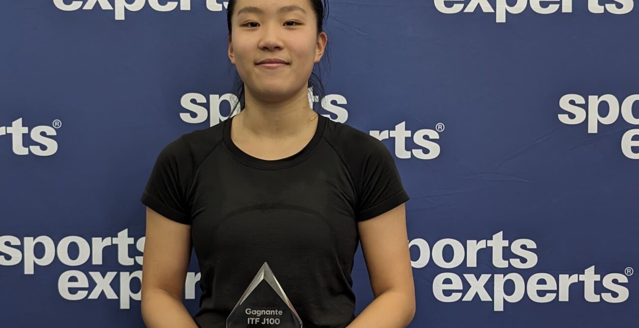 Emma Dong holds up a trophy. She and Nadia Lagaev are the top Canadians in Repentigny this week.