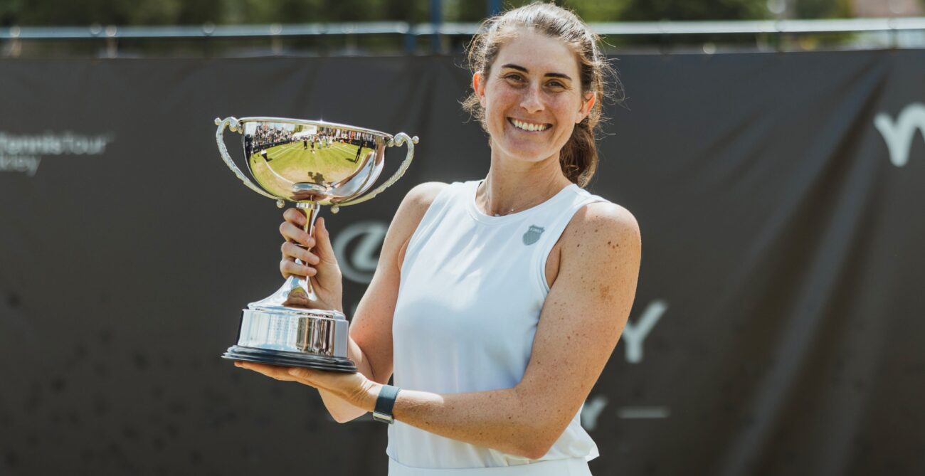 Rebecca Marino holds up the Ilkley trophy, her first title on grass. She is playing qualifying at Wimbledon this week.