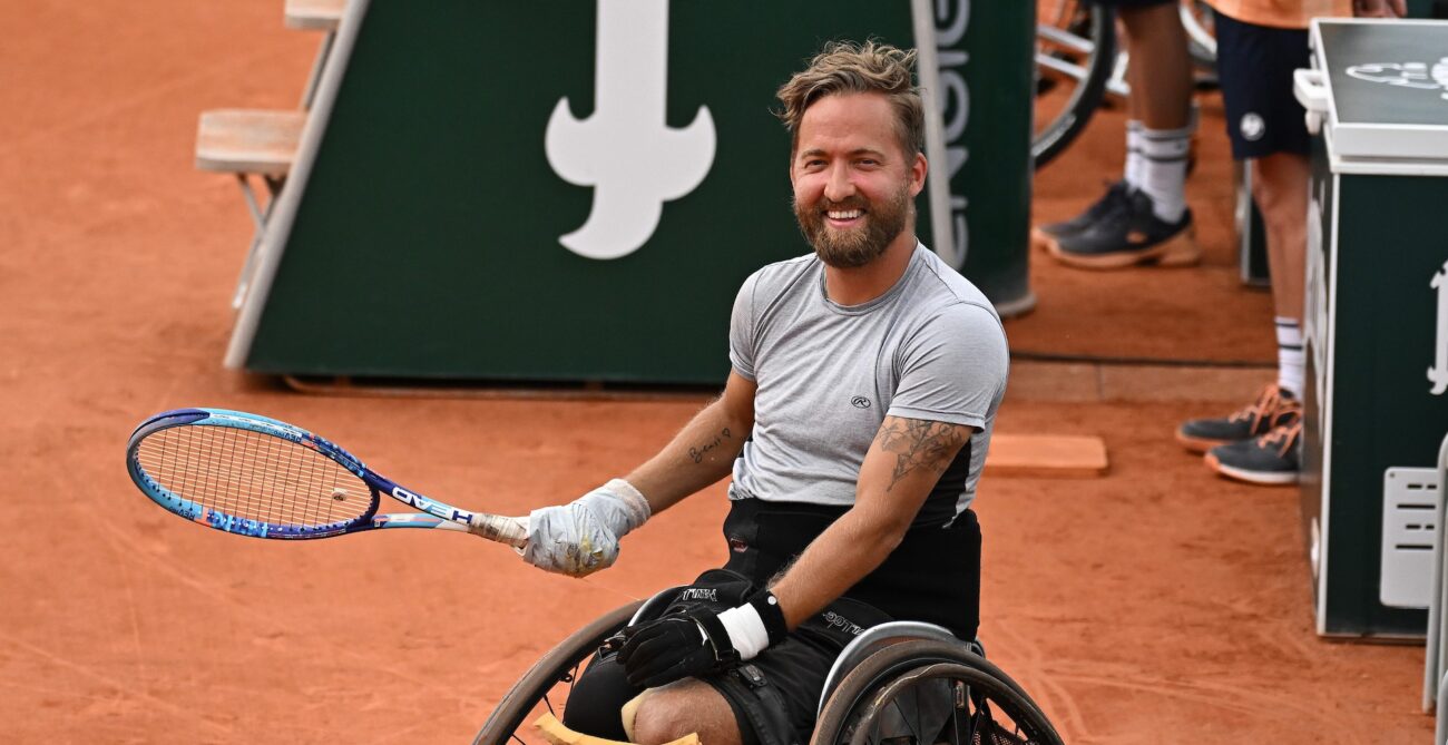 Rob Shaw smiles during his wheelchair singles match at the French Open. He will be competing at the Paralympics in July.