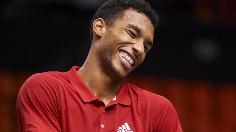 Felix Auger-Aliassime smiles during a practice