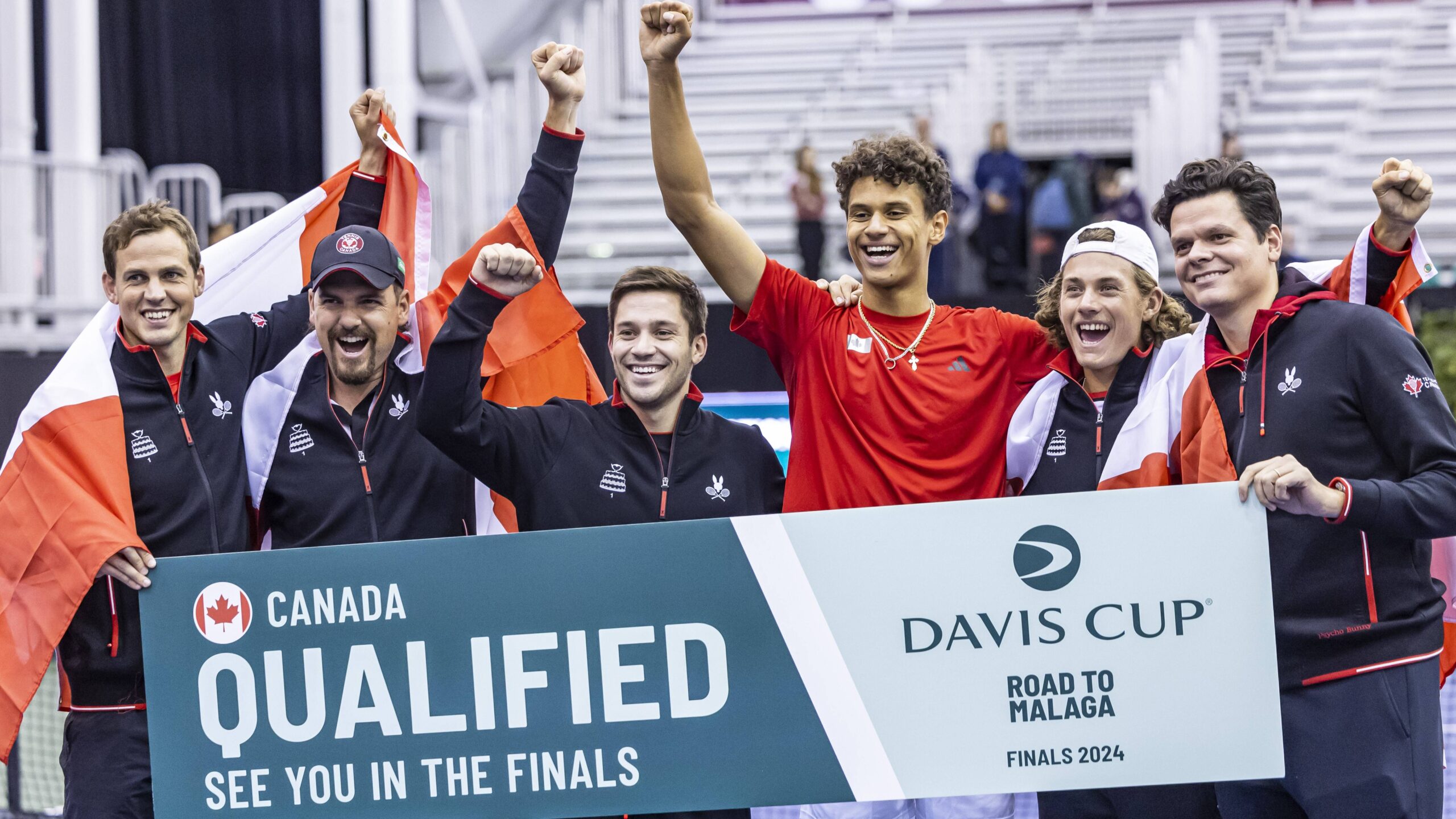 From left to right, Casek Pospisil, Frank Dancevic, Alexis Galarneau, Gabriel Diallo, Liam Draxl, and Milos Raonic celebrate the Davis Cup win for Team Canada in Montreal.