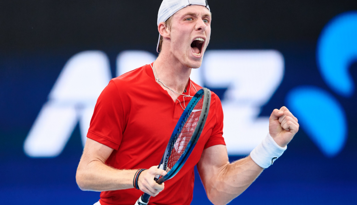 Denis Shapovalov pumps his fist and yells