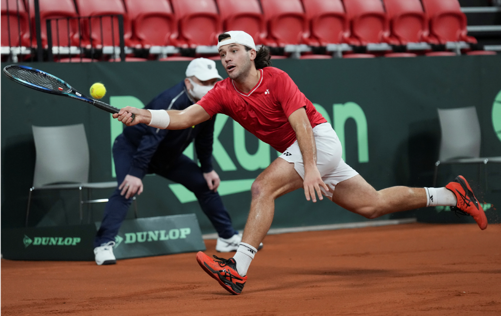 Galarneau stretches to hit a forehand at the Davis Cup