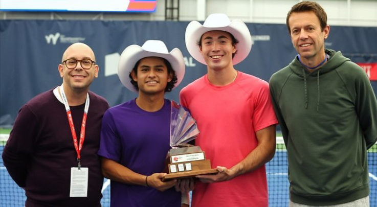 Juan Carlos Aguilar and Justin Boulais, wearing stetsons, hold the Calgary trophy.