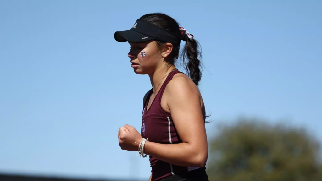 NCAA tennis player Mia Kupres pumps her fist.